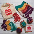 Sack Of Socks And Patterned Dice Set