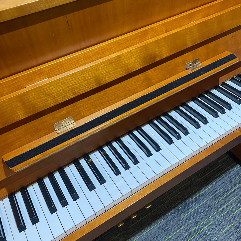 Pre-owned Yamaha E110N upright piano in cherry satin