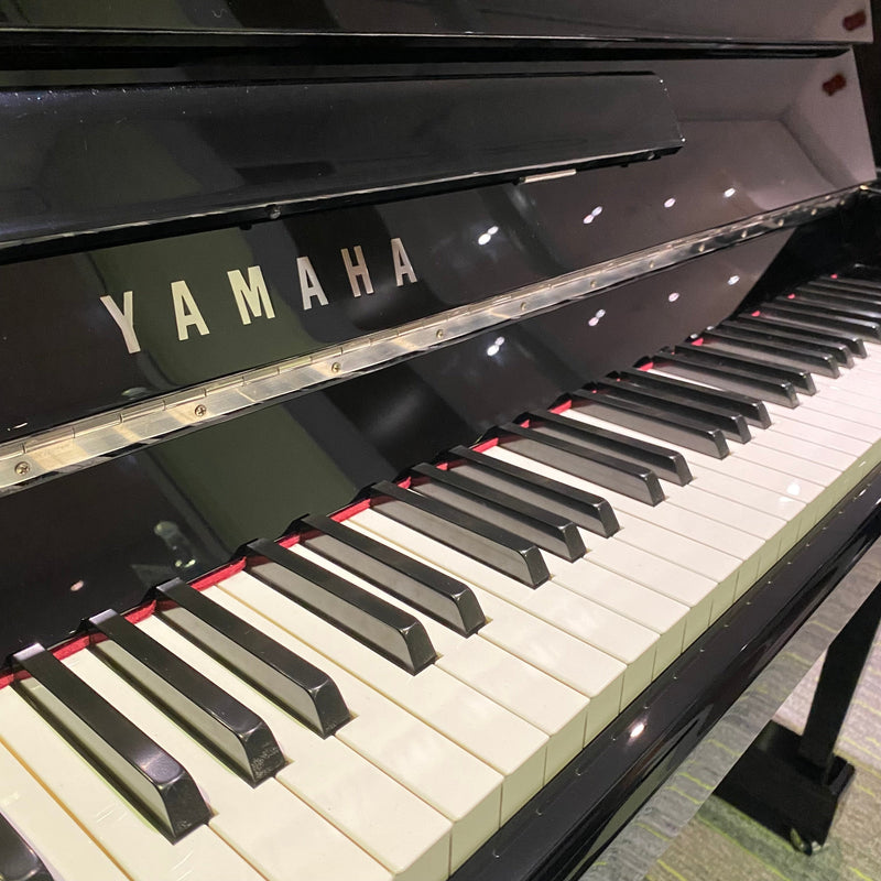 Pre-owned Yamaha P116 upright piano in polished ebony, chrome fittings